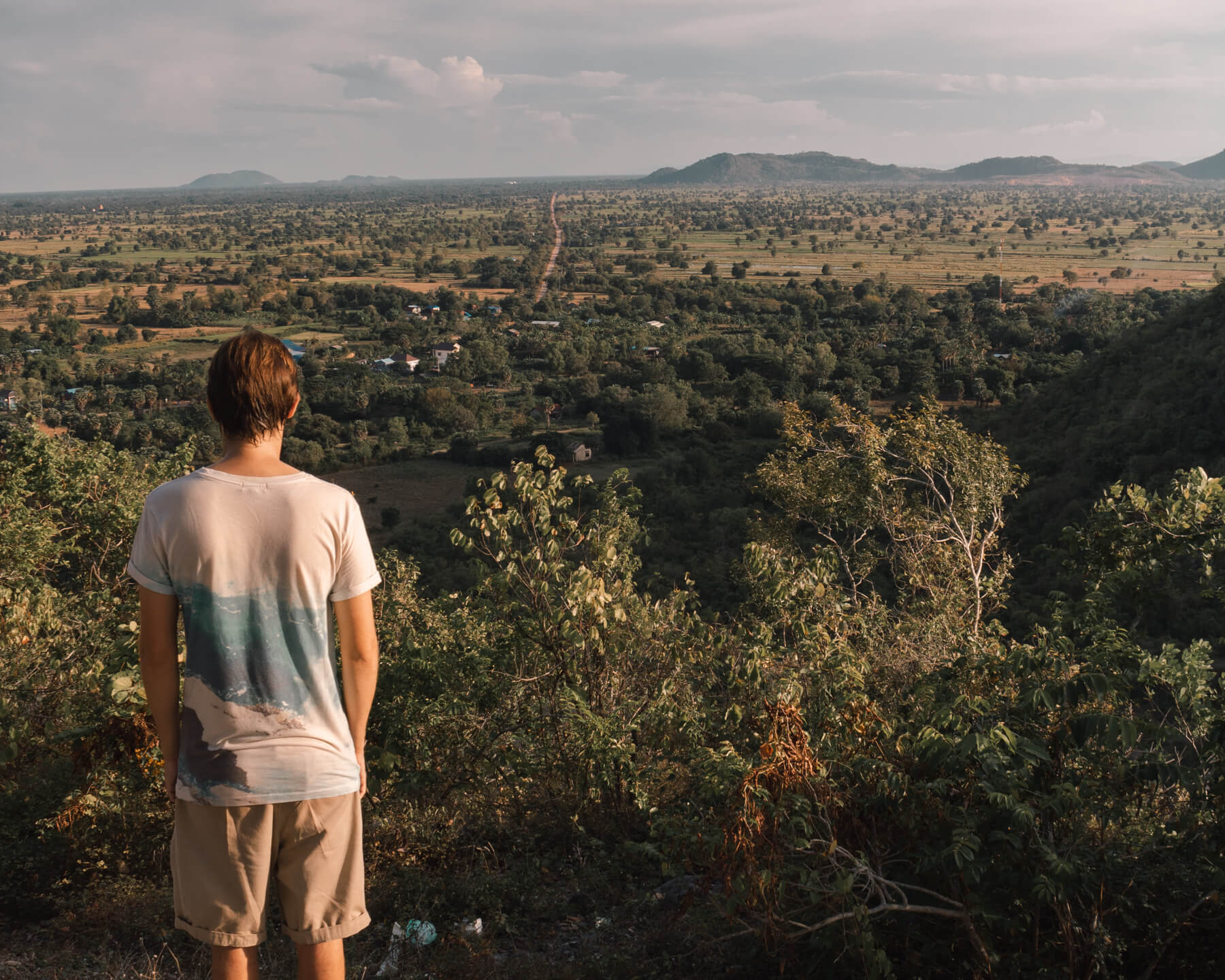 Man stood on view point at the killing caves in Battambang, Cambodia