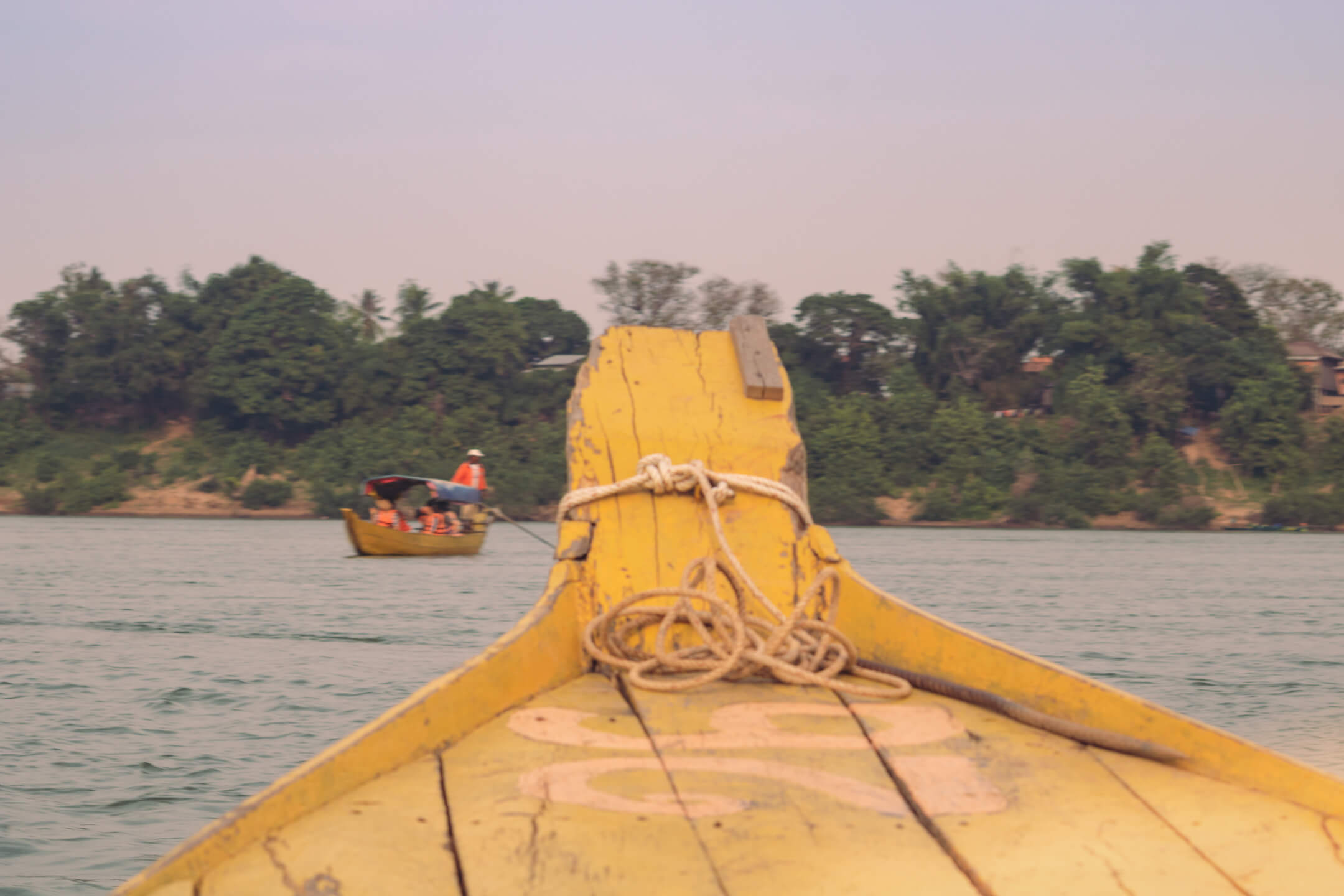Yellow boat on the Mekong River in Kampi