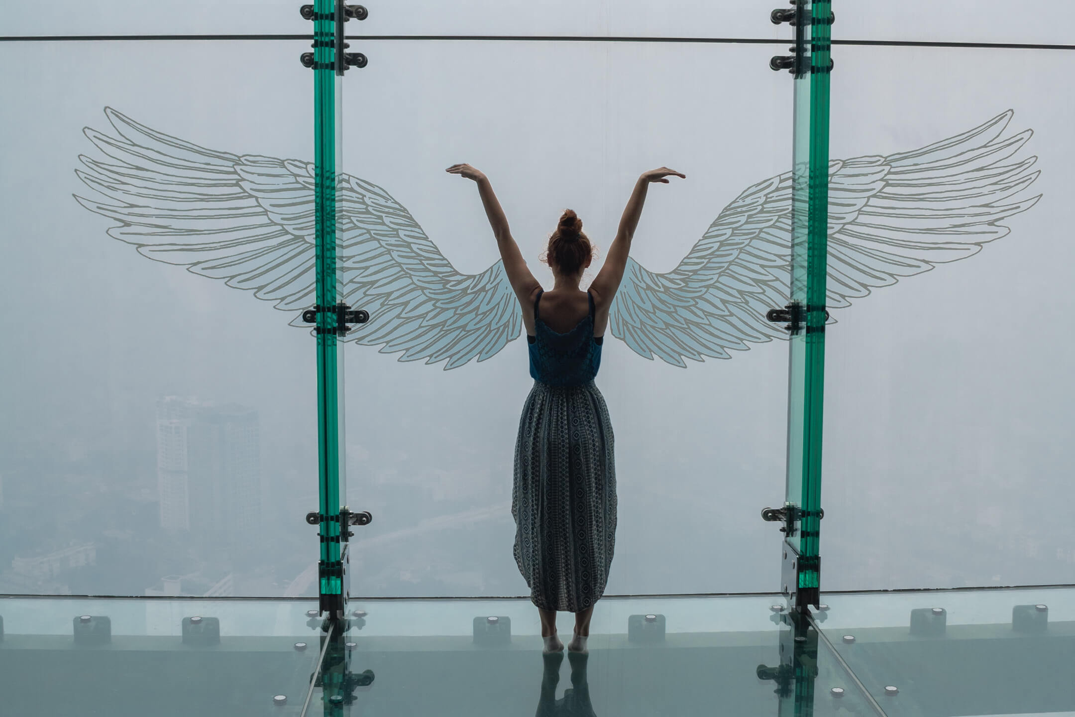 Girl at wing art on Lotte Tower Observation Deck
