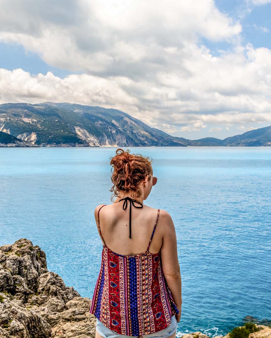 Girl stood by the sea in Kefalonia