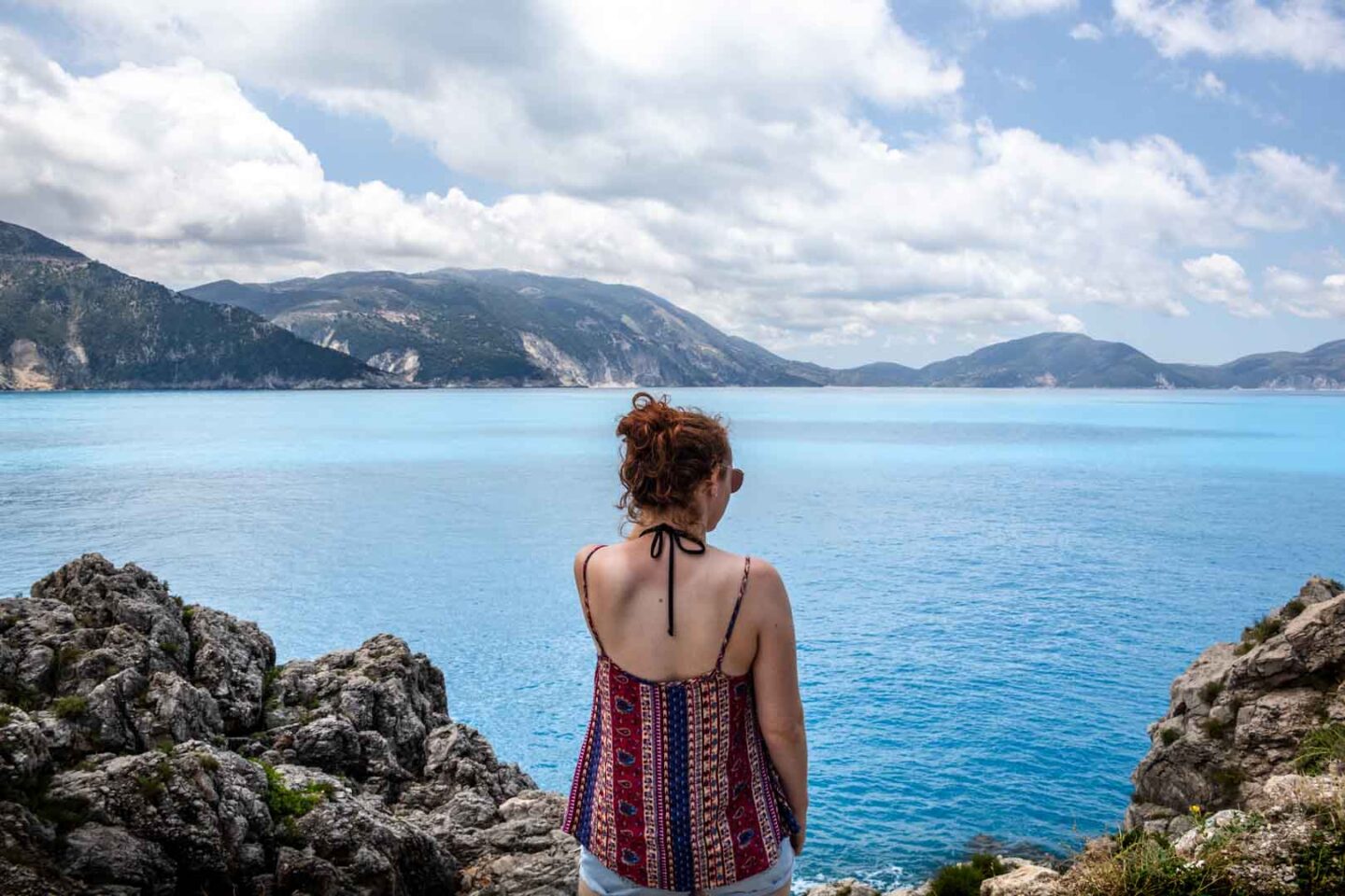 girl stood at a viewpoint in Kefalonia, Greece